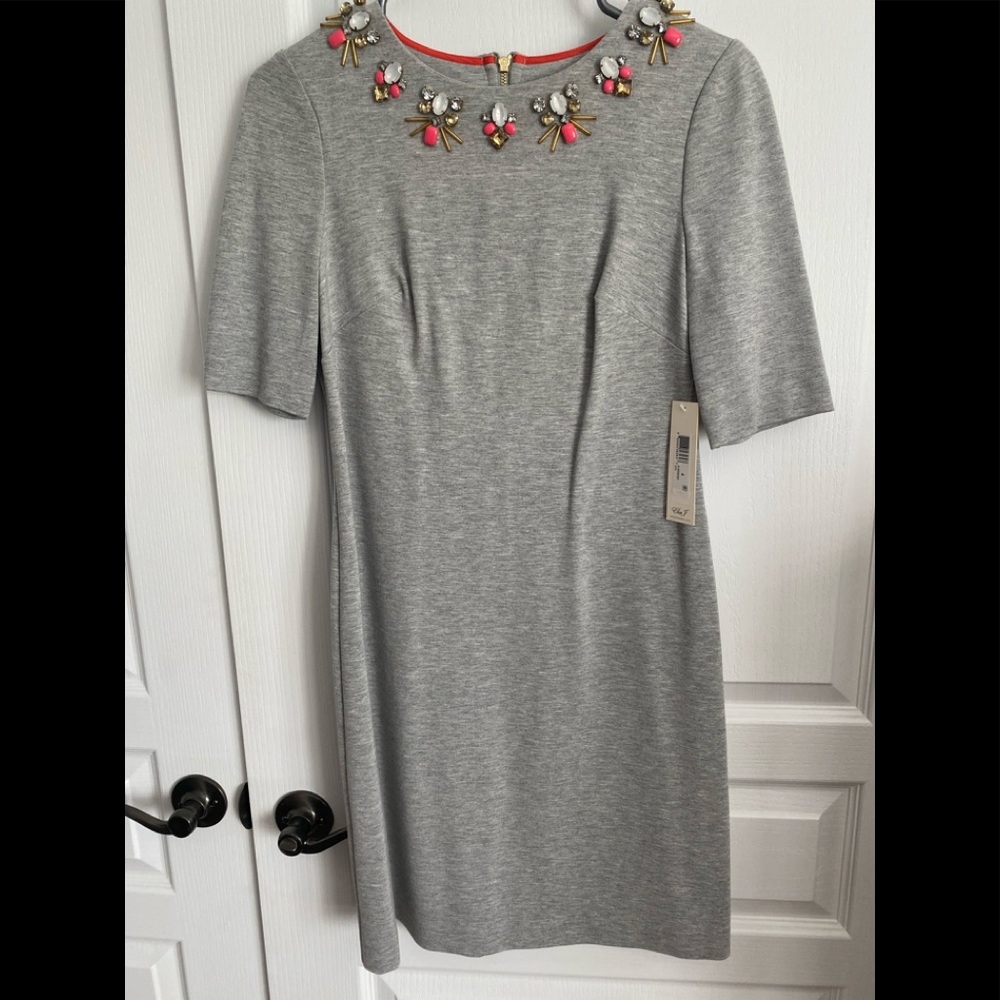 Fitted grey dress with neckline emblishment